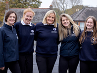5 Clarity staff in their uniforms smiling